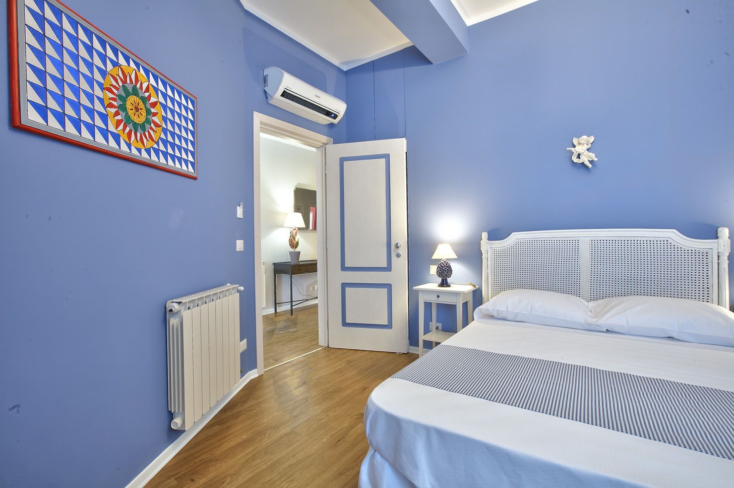 The Blue Room, double, with a Vienna-straw headboard